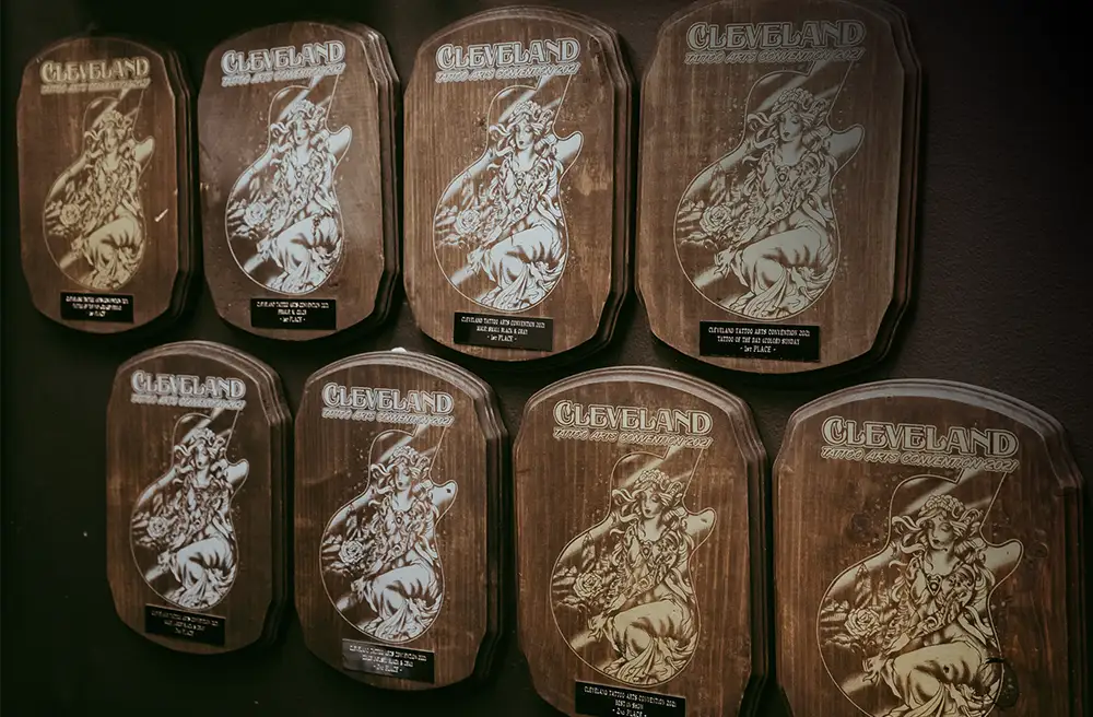Cleveland Tattoo Arts Convention award plaques won by Blackwater Ink, an award-winning studio in Niles, Ohio