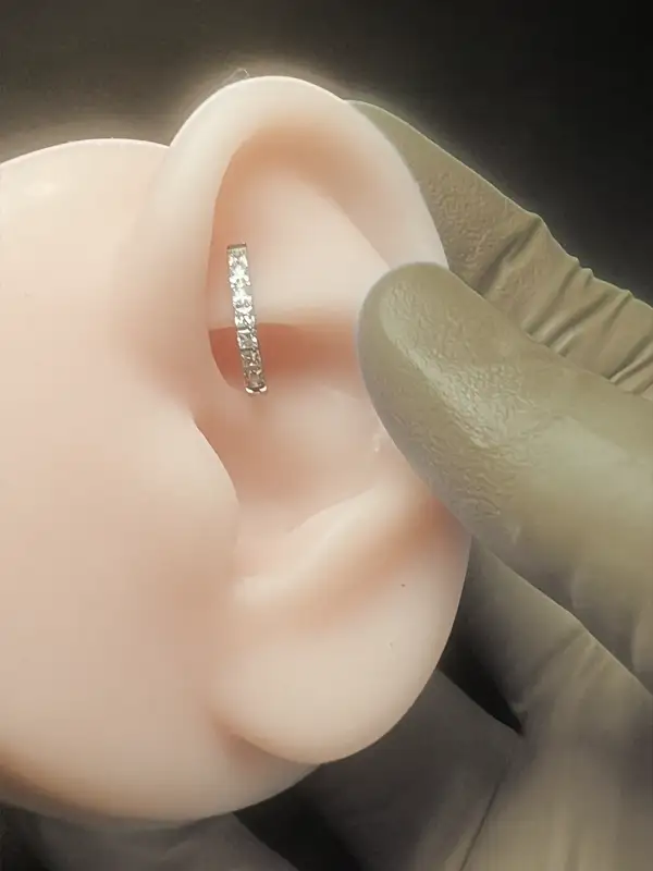 Ear piercing by a professional piercer at Blackwater Ink in Niles, Ohio